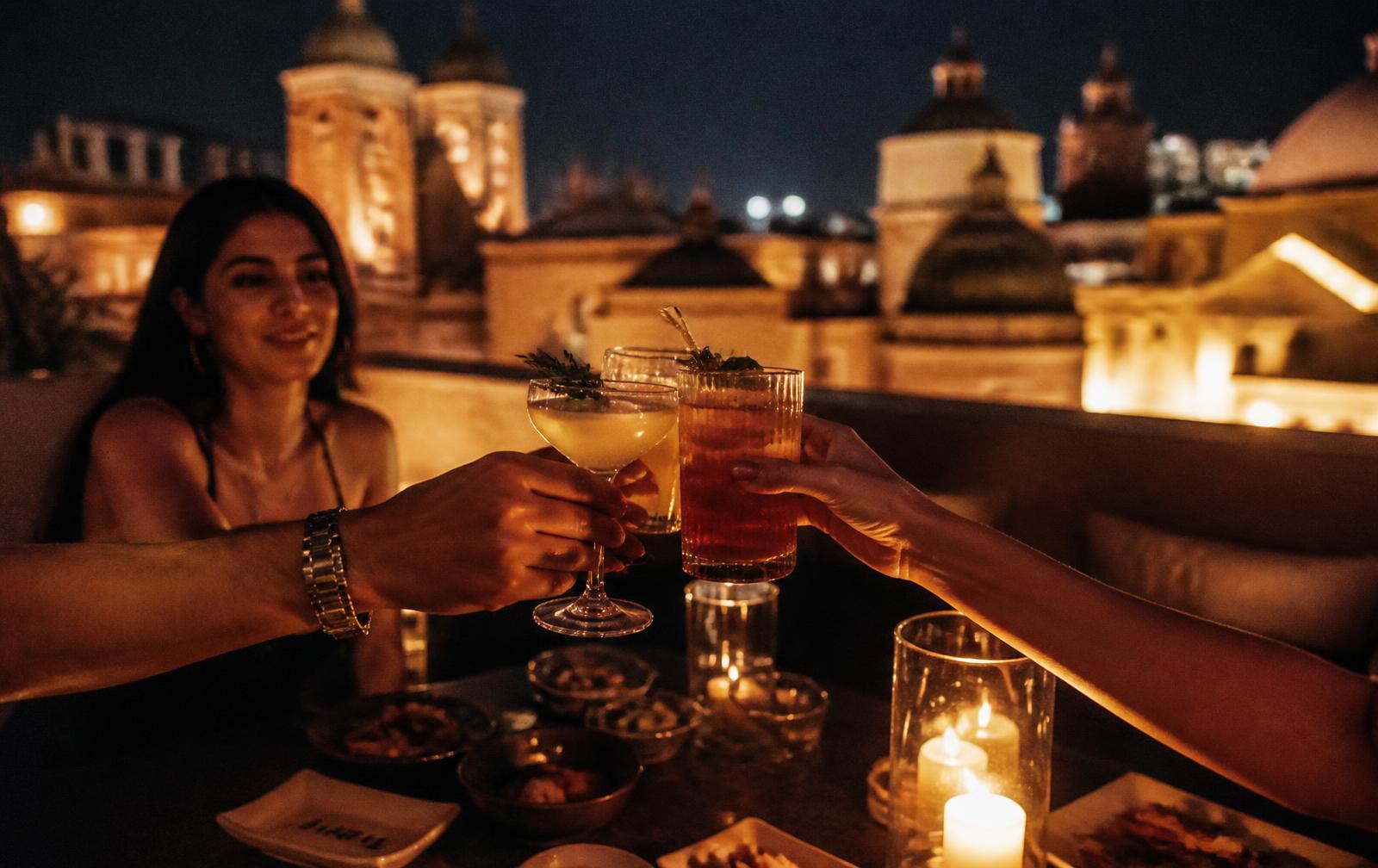 Guests toasting cocktails at an Aztechy night